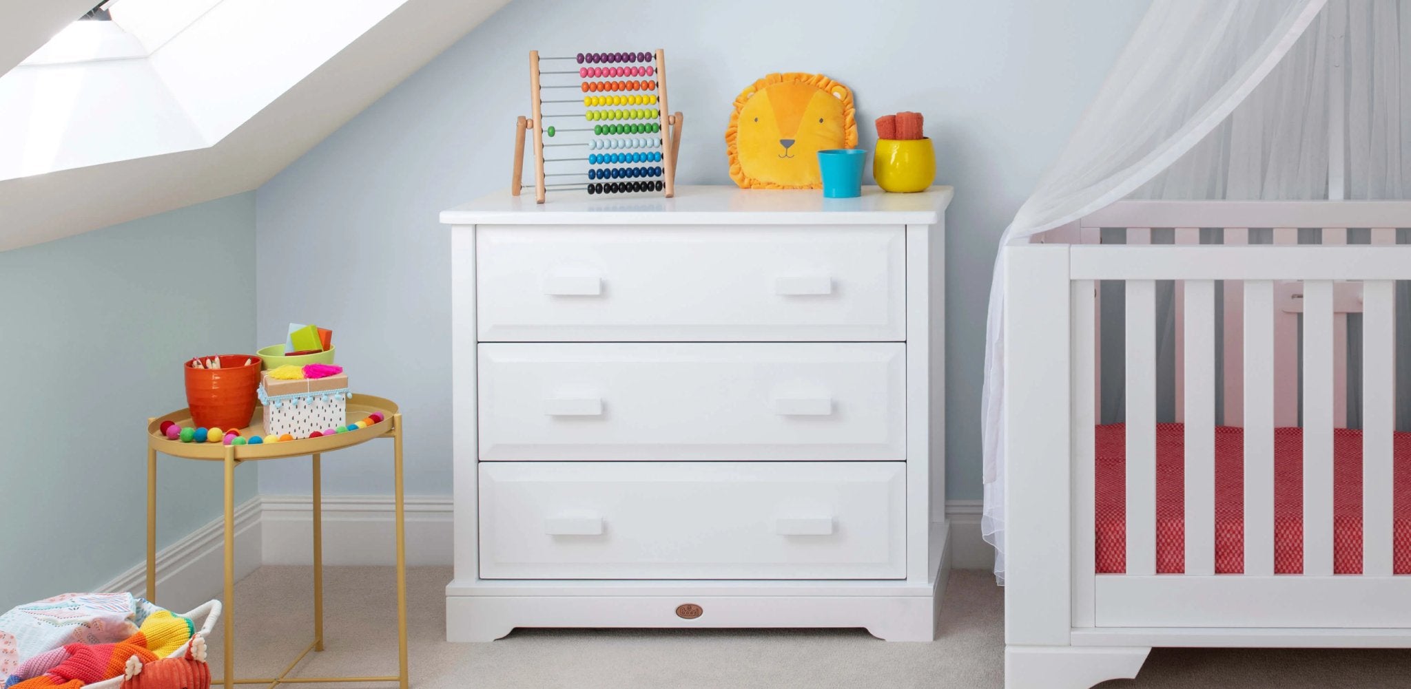 white 3 drawer dresser in nursery with cot