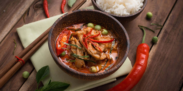 bowl of curry with red peppers