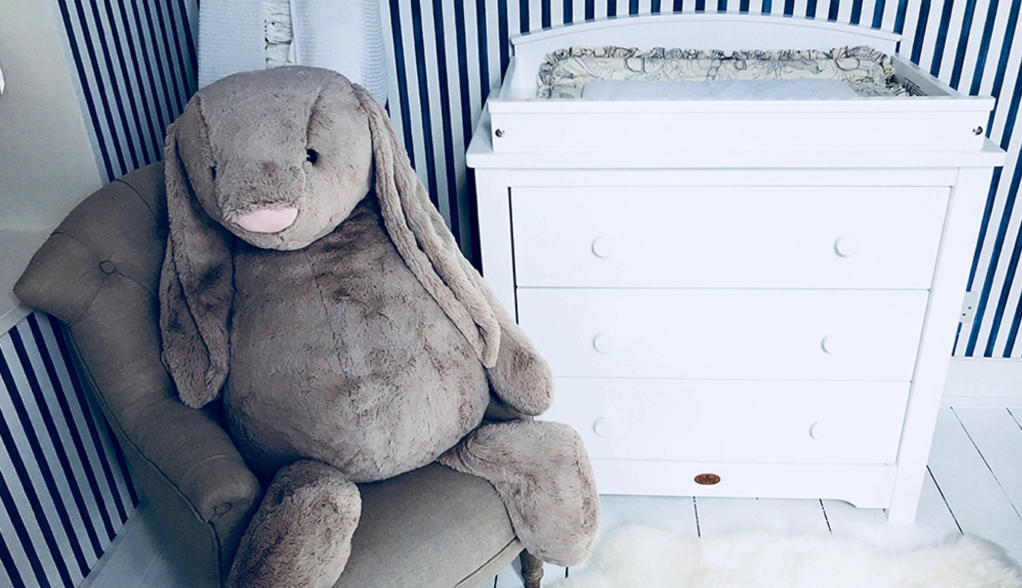 3 drawer chest with changing station and big rabbit plush toy