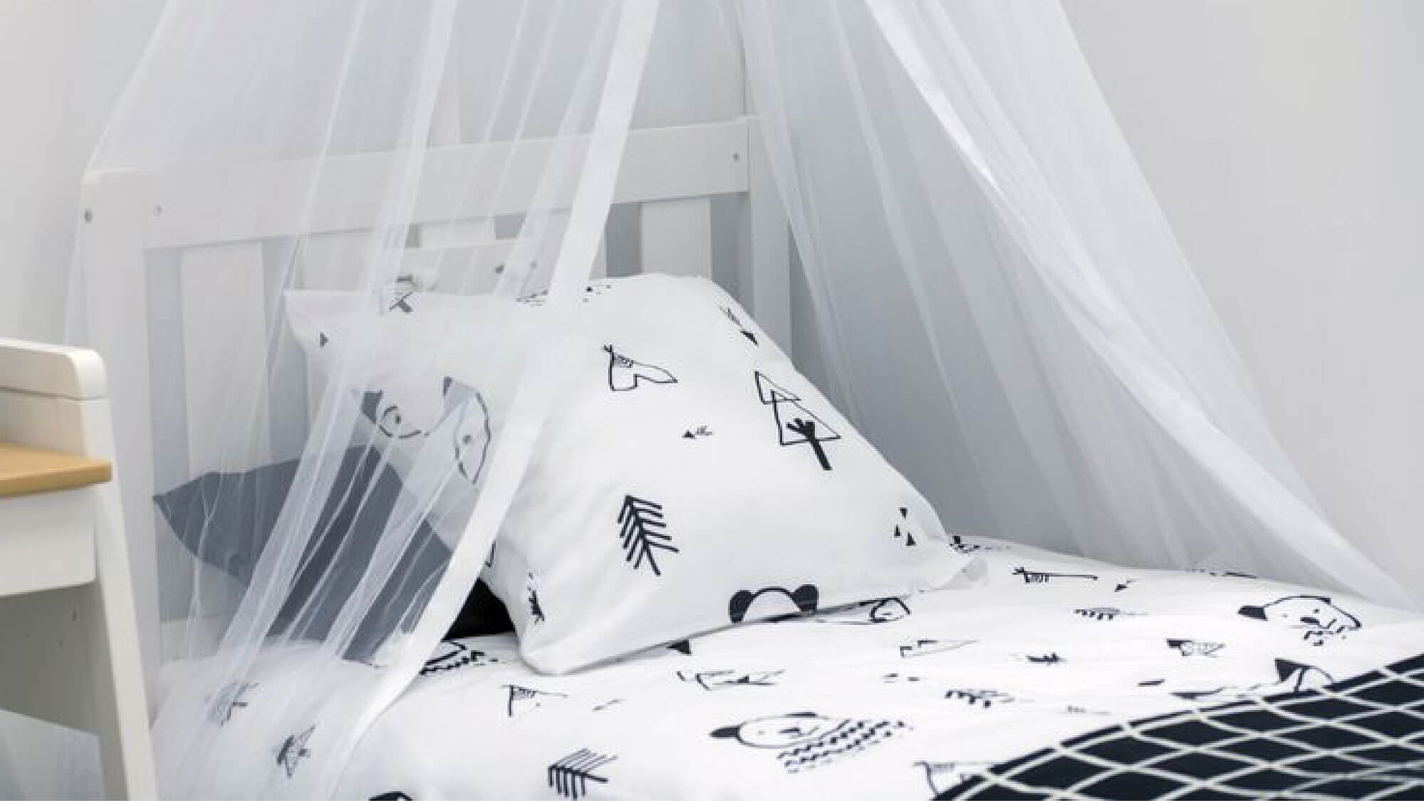 Bed with white canopy