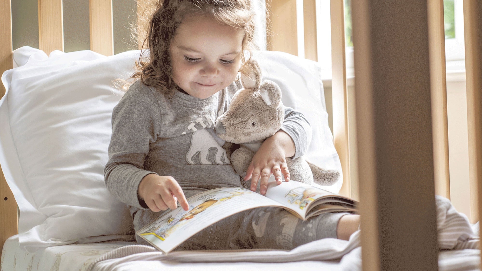 Girl reading in bed