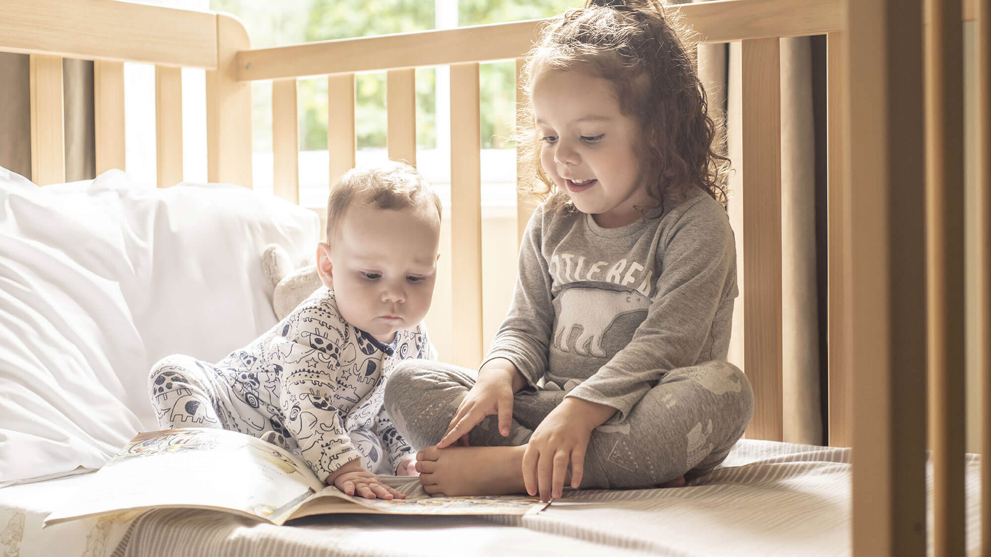 Child reading to sibling
