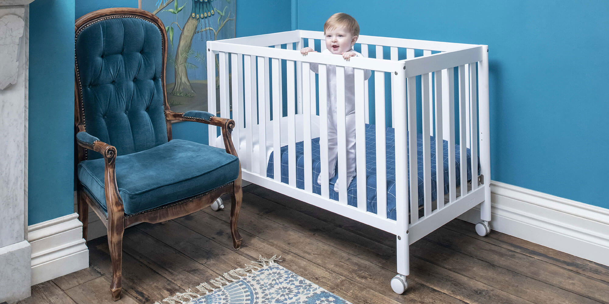 Baby in Heron Compact Cot