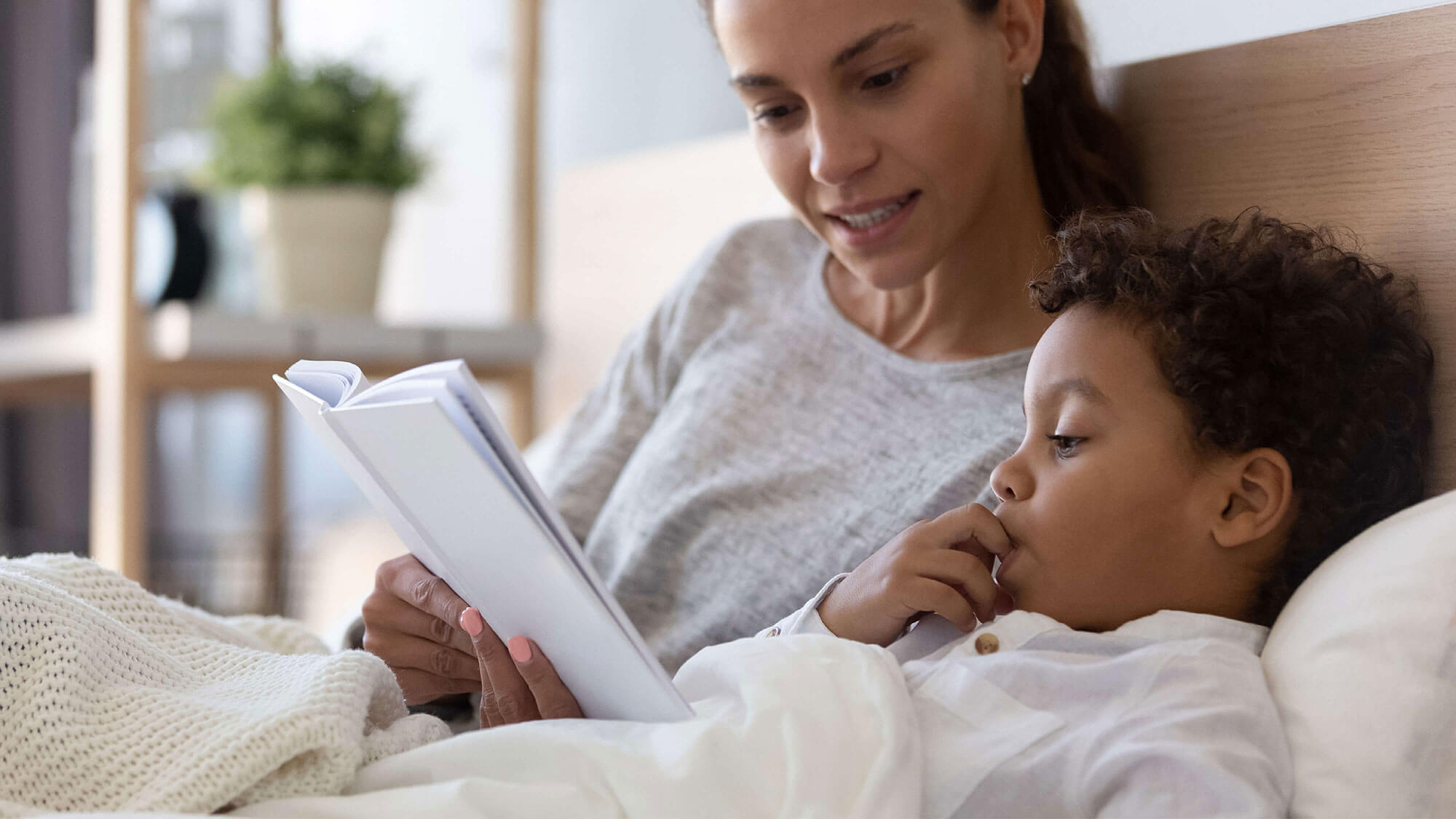 Mum reading to child