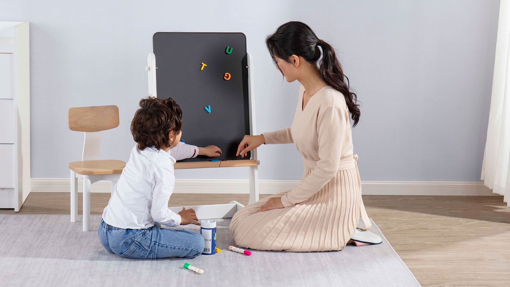 Mum and child using Tidy Magnetic Drawing Board