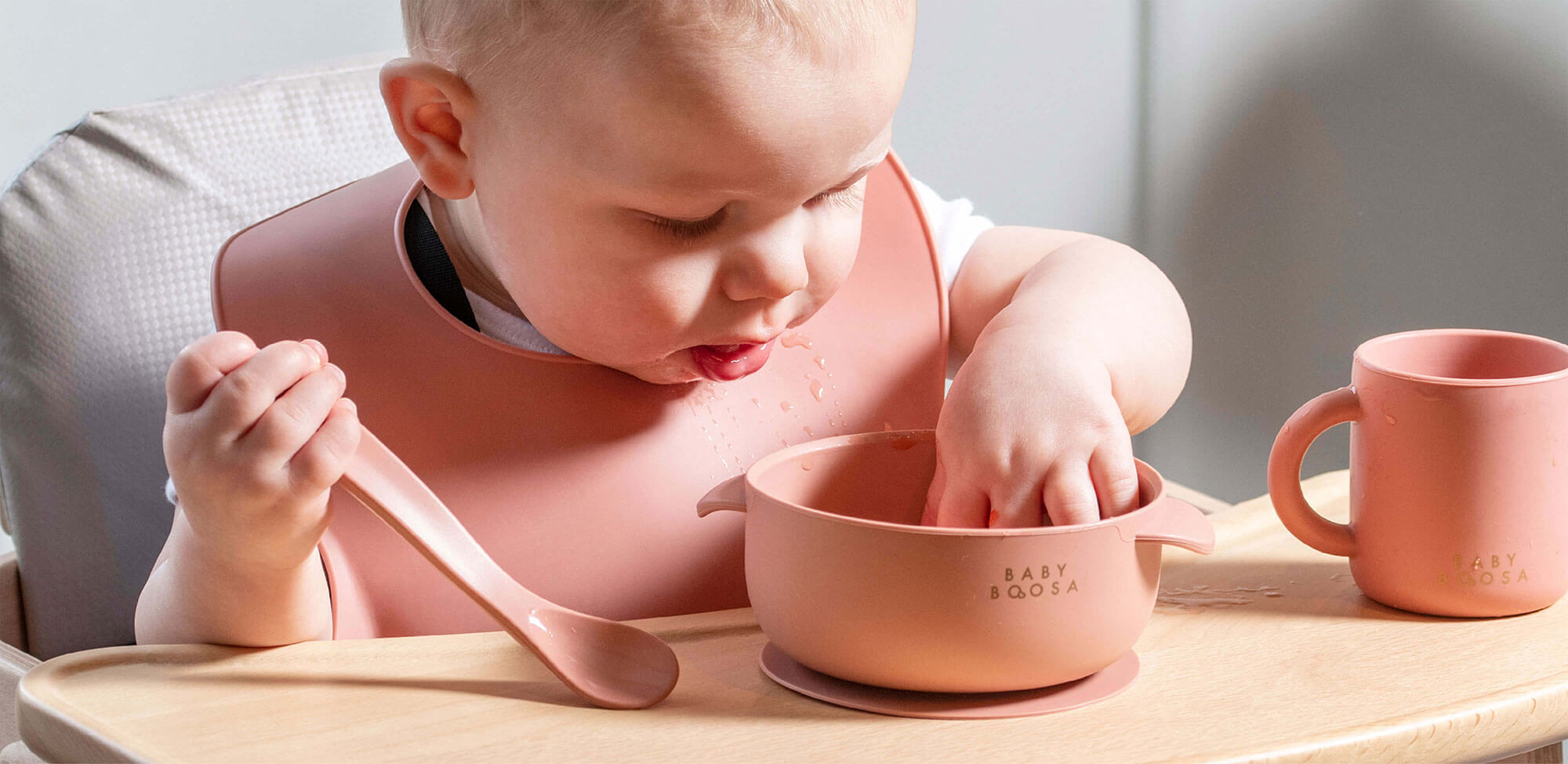 Toddler using toddler tableware