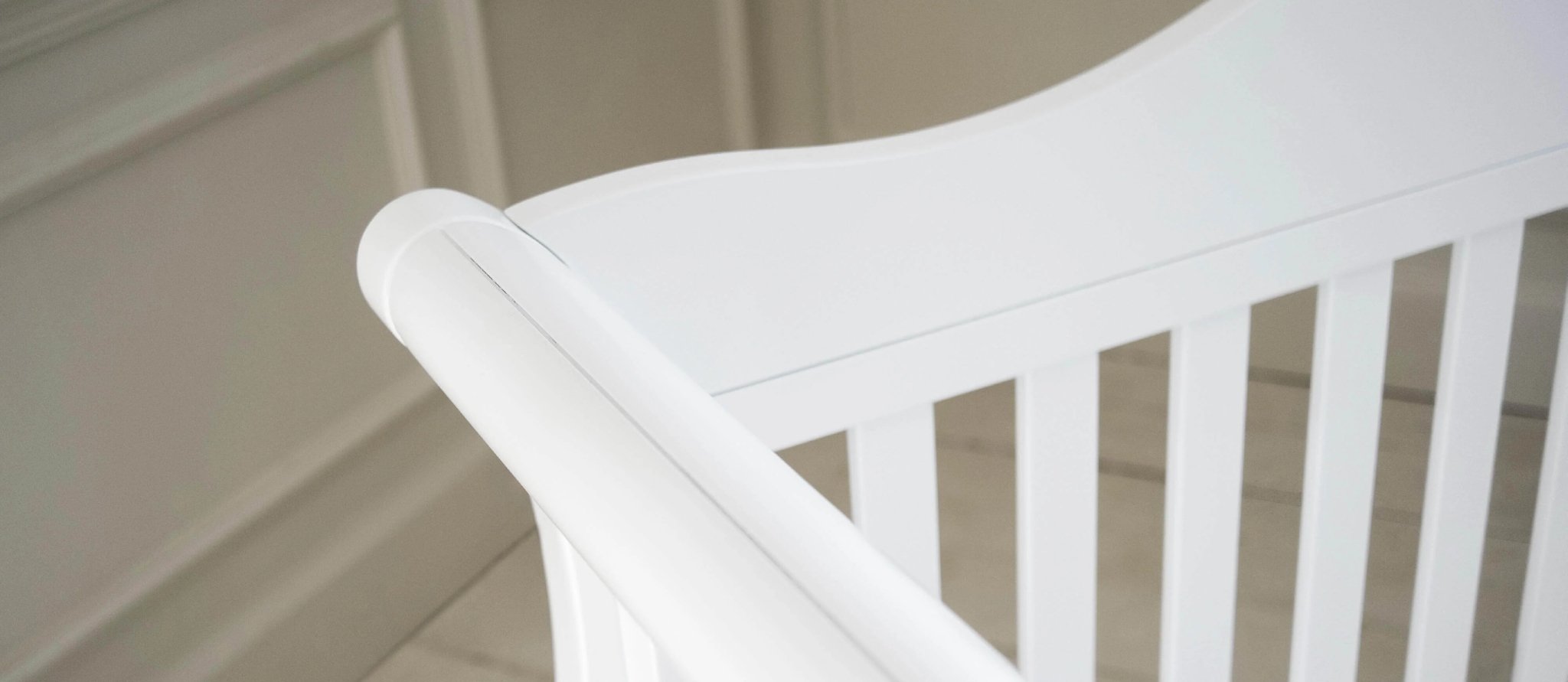 Sleigh style white cot