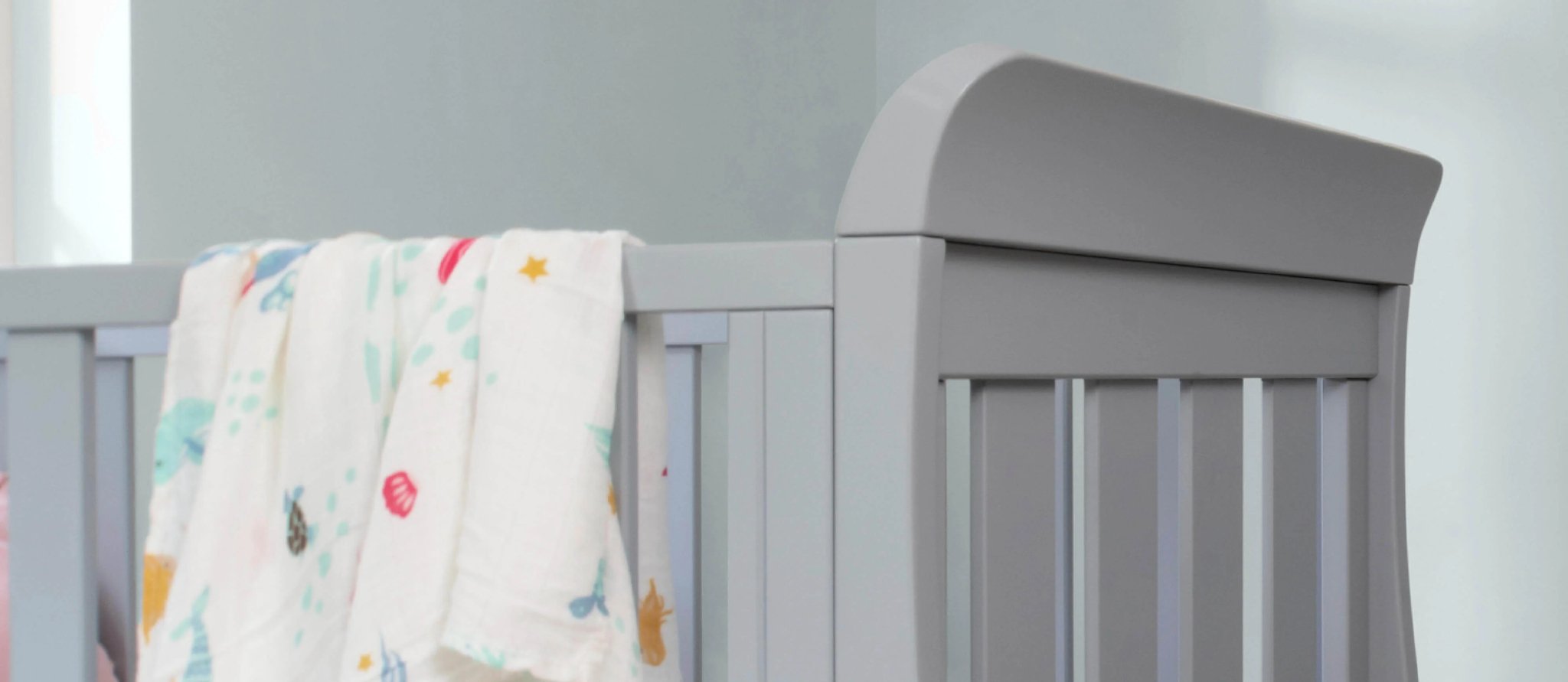 Grey sleigh style cot