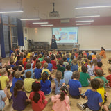 Reading my book to 180 pupils at my son’s school celebrating their rainbow day for Pride
