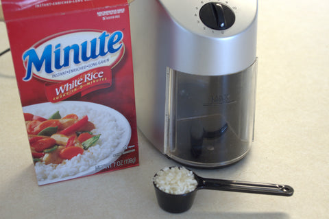Capresso infinifty burr coffee grinder and minute rice used to clean grinder