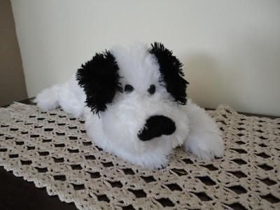black and white plush dog