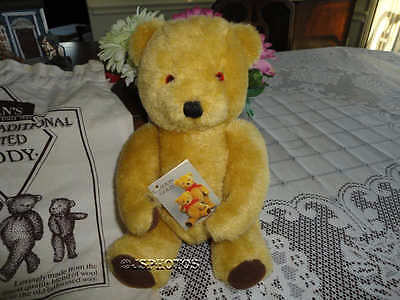 vintage teddy bear with bell in ear