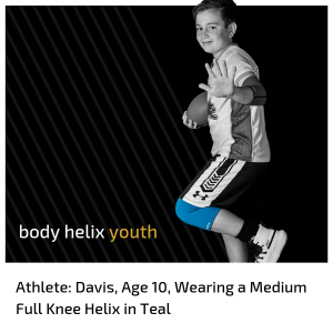 boy with a football wearing a Full Knee Helix that helps with Osgood-Schlatter's Disease sometimes called osgood schlatters disease