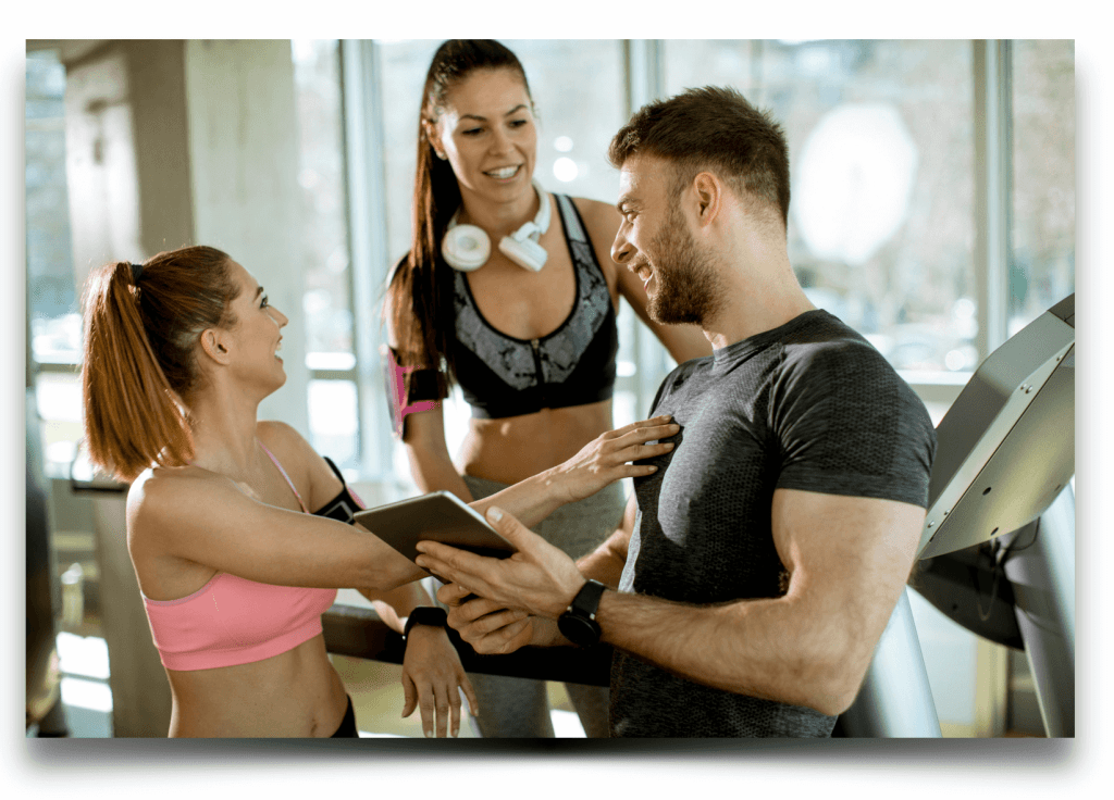 Coach and students working out at fitness center which creates a feeling of connectedness.<br>