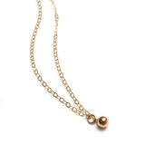 Close up of Super Petite Gold Bauble Necklace