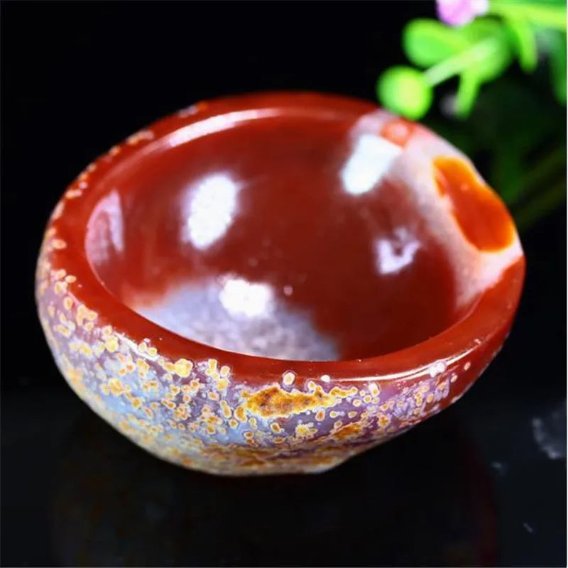 Bol en agate pierre orange de Sardonyx feuille verte en arrière plan