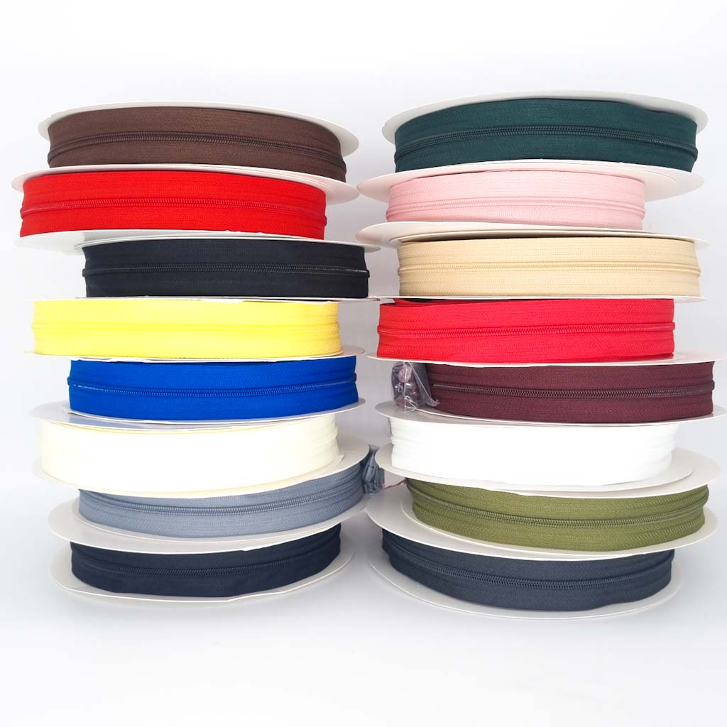 Rolls of continuous zip tape in various colours