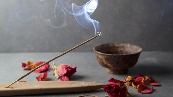 lit incense on a table