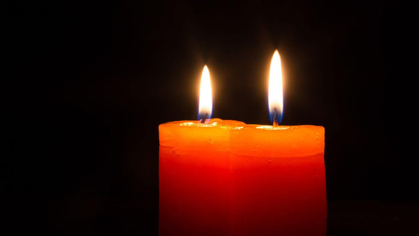 candles lit on a dark background