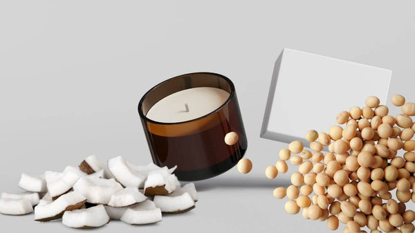 a candle with coconuts to the left and soybeans to the right