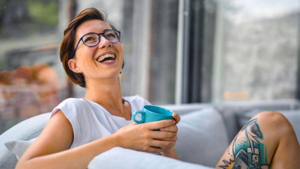 a happy woman relaxing at home