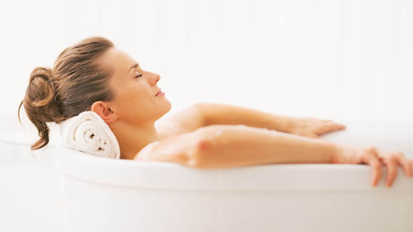 a woman relaxing in the bathtub