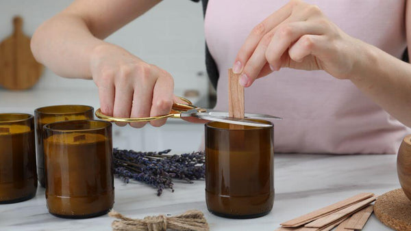 a woman trimming candle wicks