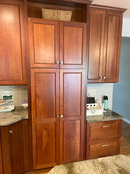 Cherry colored kitchen cabinets before transformation