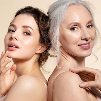 Mother-Daughtert image with glowing skin from the shoulders up, for our blog post on Revitalizing and Hydrating Facial Skin.