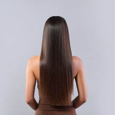Woman with healthy hair showing hair from behind.