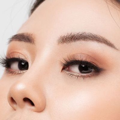 Upclose facial picture showing upper face of an Asian woman with beautiful eyebrows, for our blog post on Revitalizing Your Brows