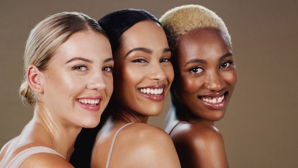 Picture showing three women with beautiful skin from the shoulders up, for our blog post on Gentle Skin Peel at home.