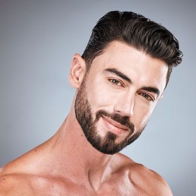 Up close picture of man with thick brown hair, for our blog post on Nutrafol Men.