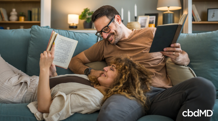 Happy Couple on Couch Relaxing with Functional CBD Products