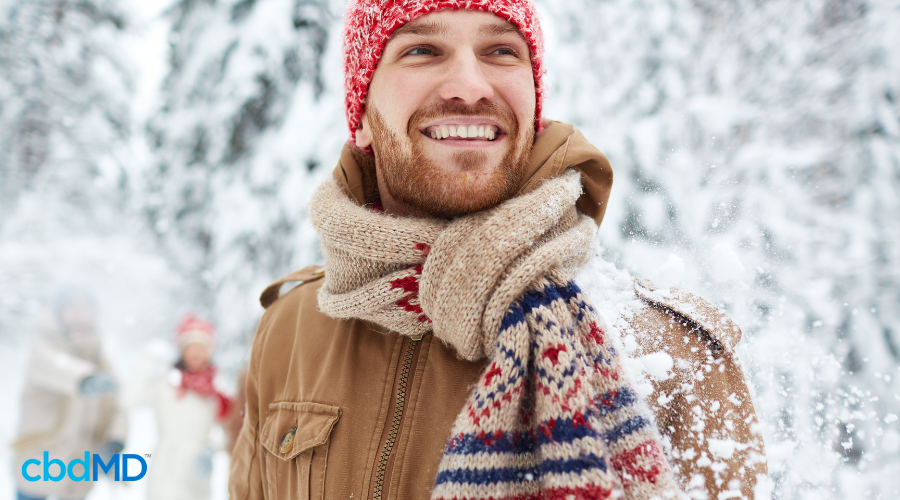 Man Feeling Happy in Winter with CBD Gummies