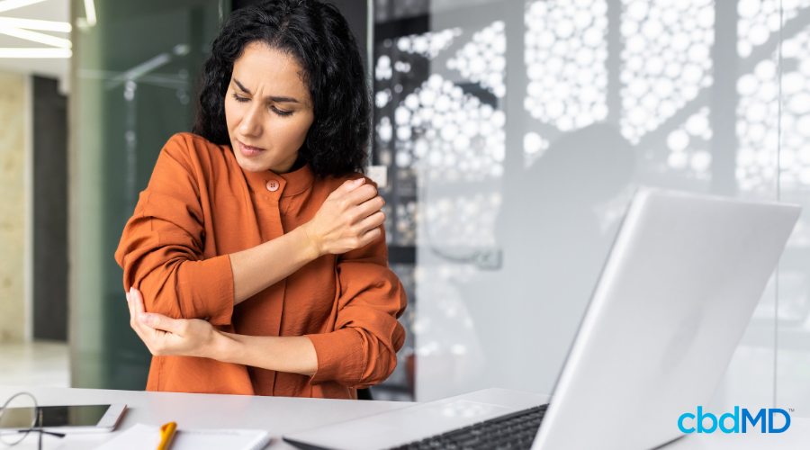 Woman Holding Elbow with Joint Pain