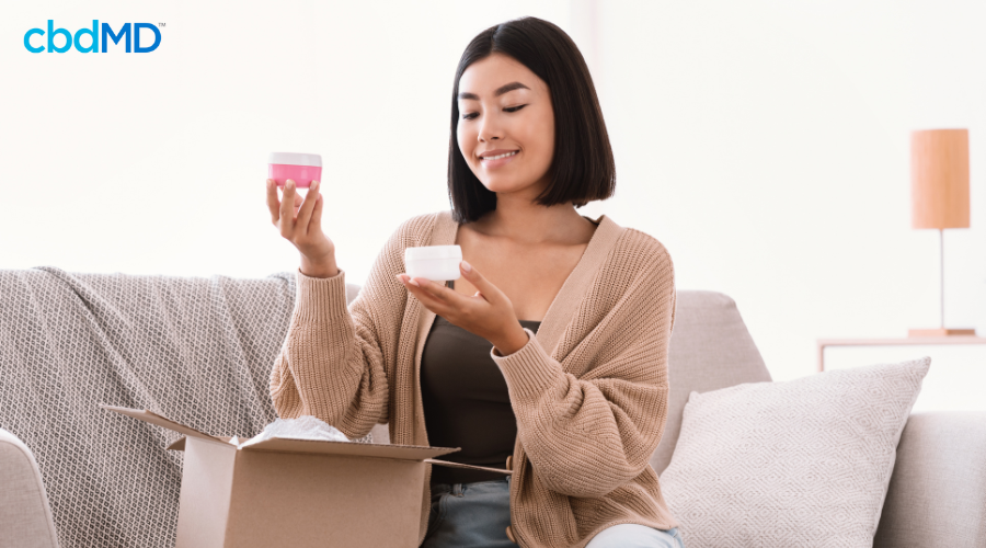 Woman Packing Mother’s Day Care Package for Mom