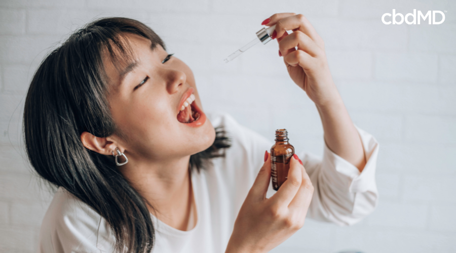 Woman Taking CBD Tincture for Daily Wellness
