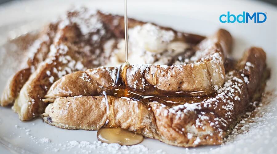 A fresh stack of cbd french toast sits on a plate