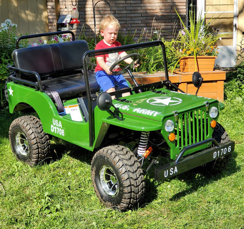 willy's 125cc mini jeep in army green with 6 year old rider