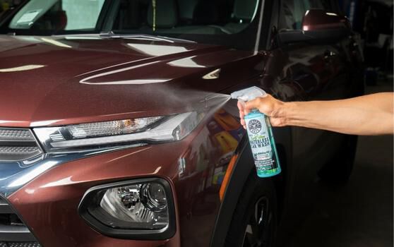 Spraying Waterless Car Wash on a Vehicle