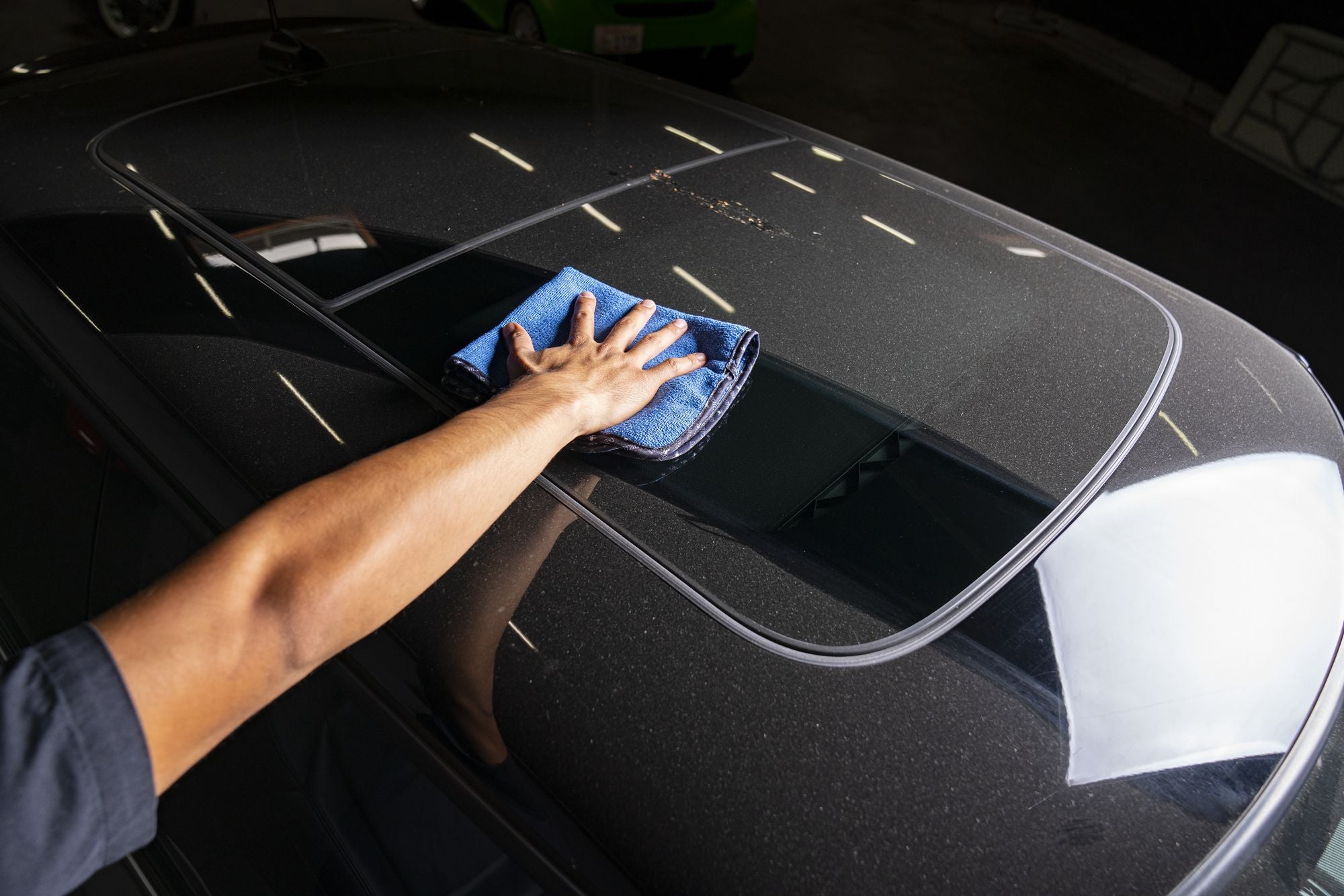 Monster Extreme Thickness Towel wiping dust off a car.