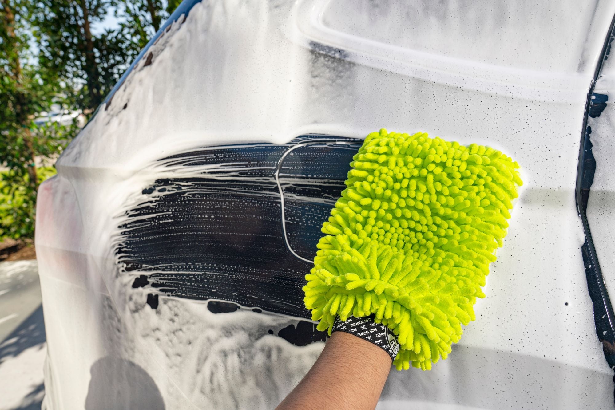 Wiping the suds off the back of a vehicle with the Chenille Wash Mitt
