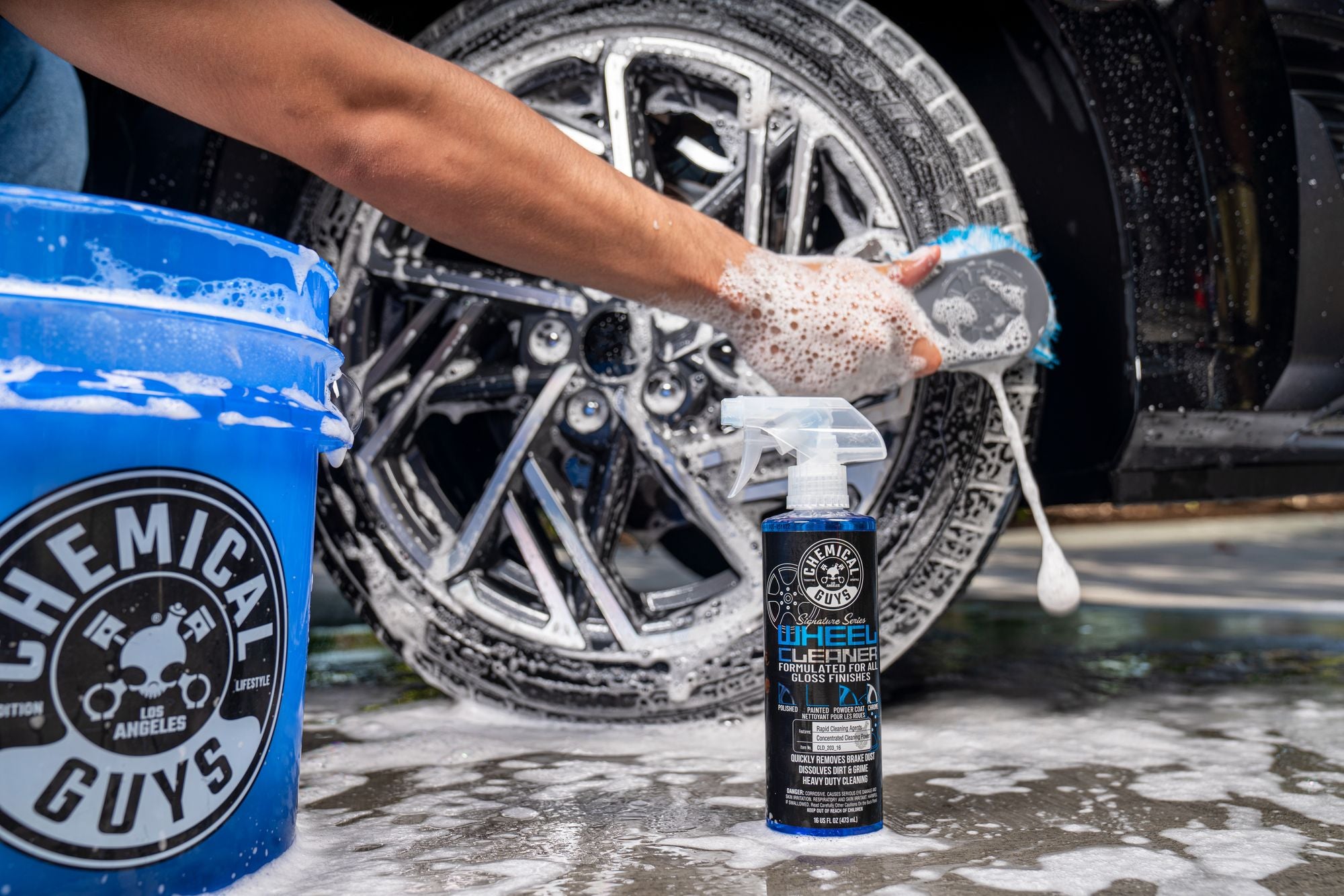 Cleaning wheel and tire with Signature Series Wheel Cleaner and the Big Blue Stiffy Heavy Duty Tire Brush