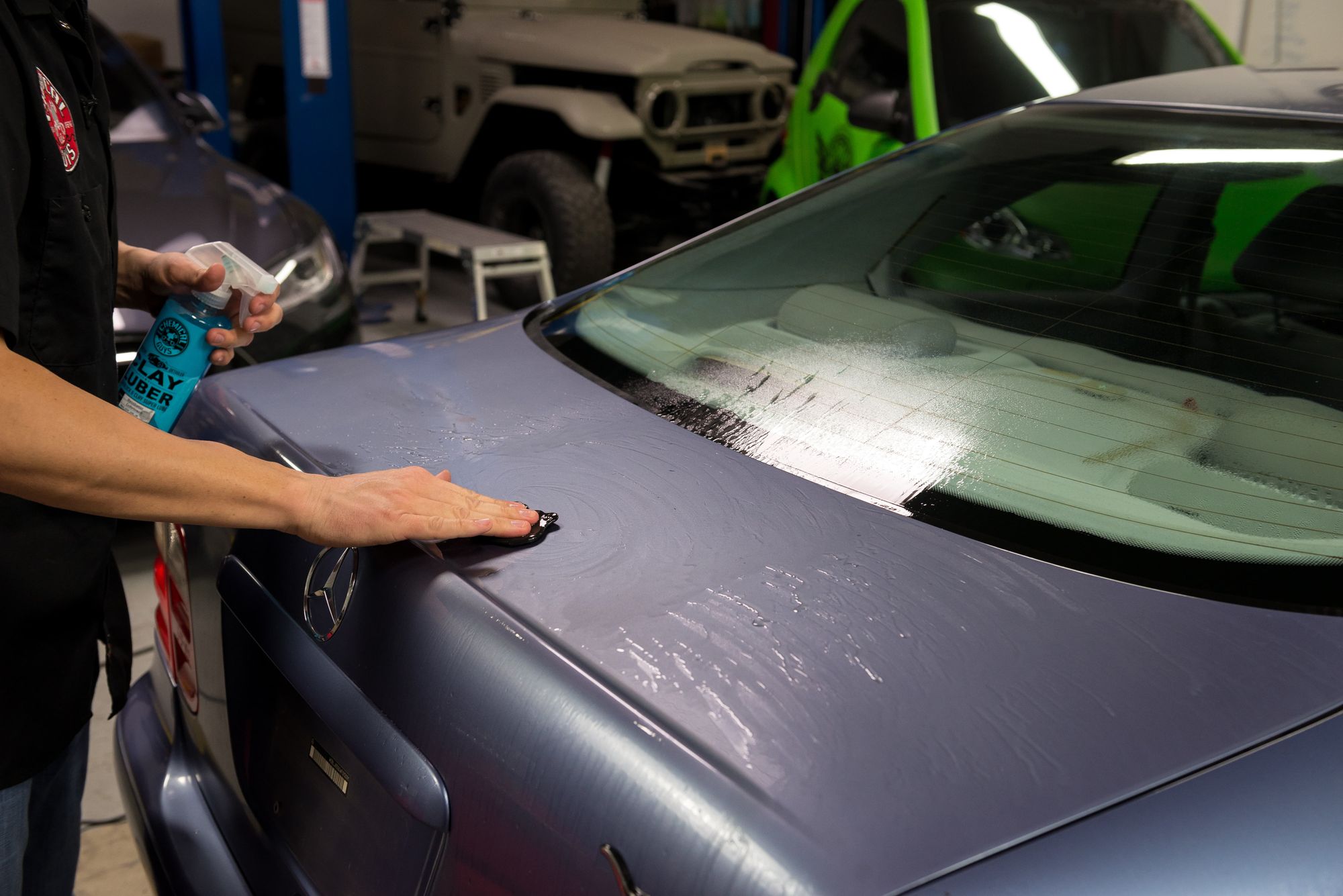 Decontaminating the trunk of a car using Clay Luber and the Heavy Duty Clay Bar