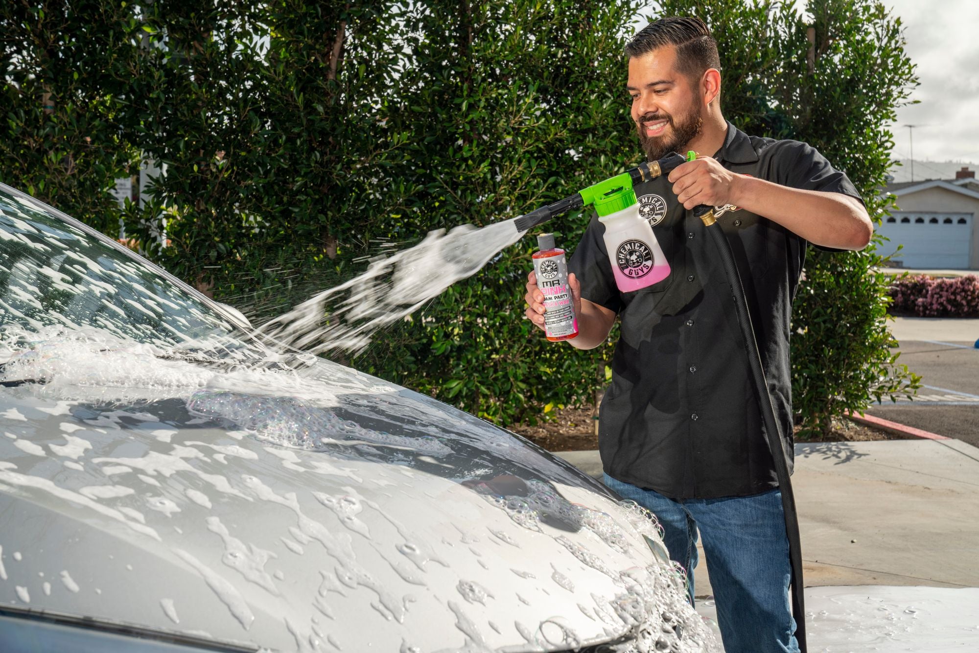 Spraying a car with foam using Mr. Pink Foam Party and the TORQ Foam Blaster 6