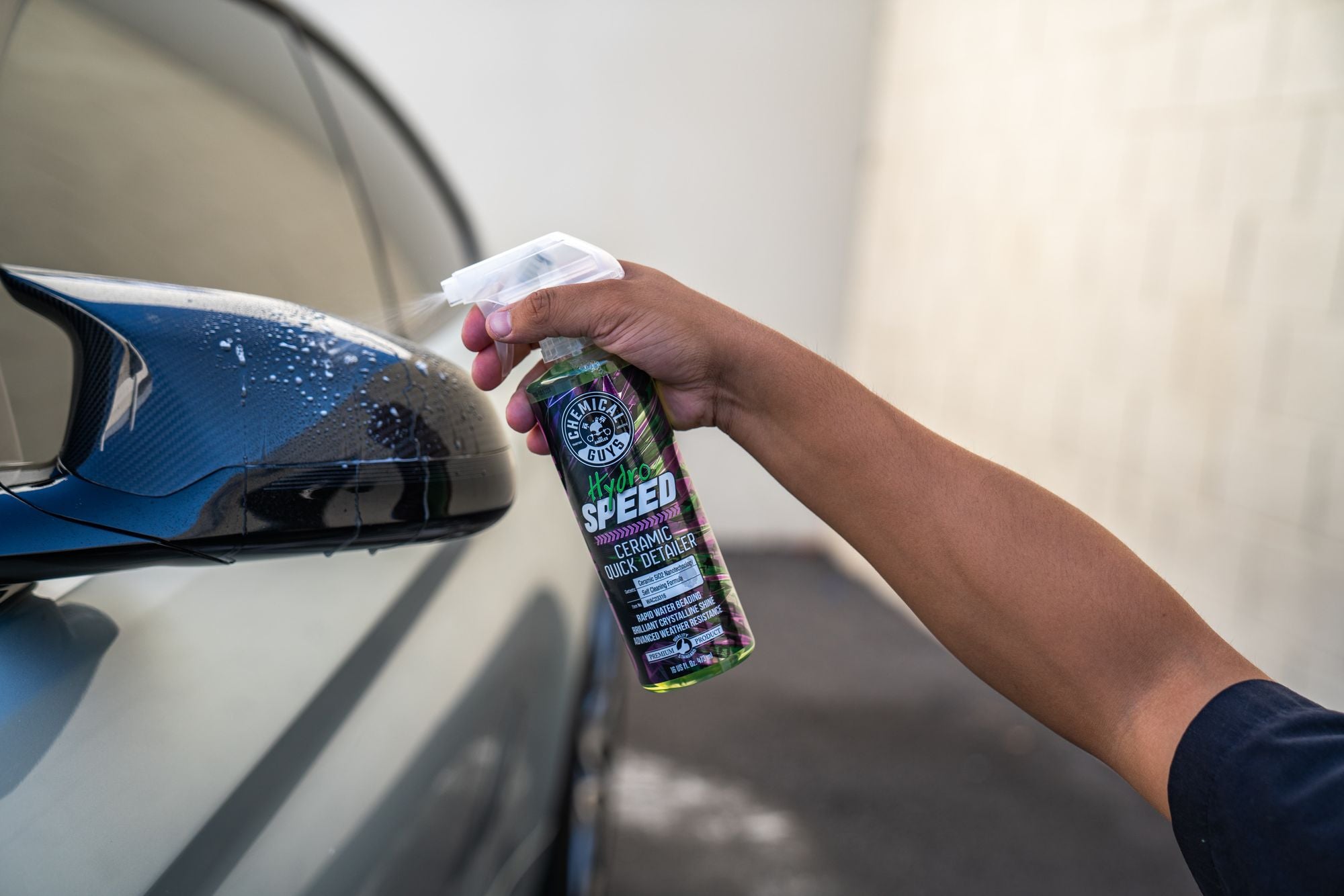 Spraying HydroSpeed onto a car