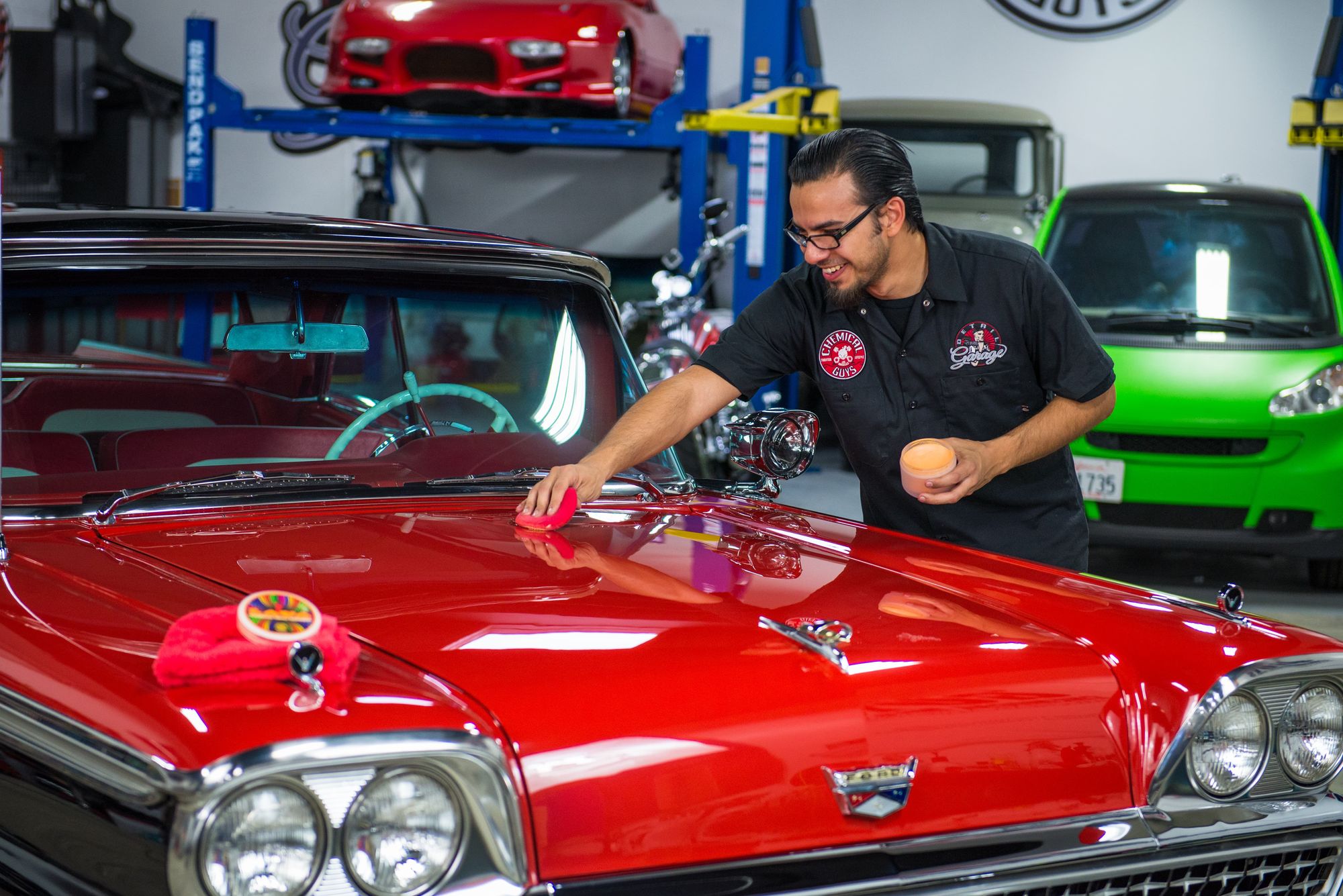 Applying creme wax to a car with a UFO Applicator.