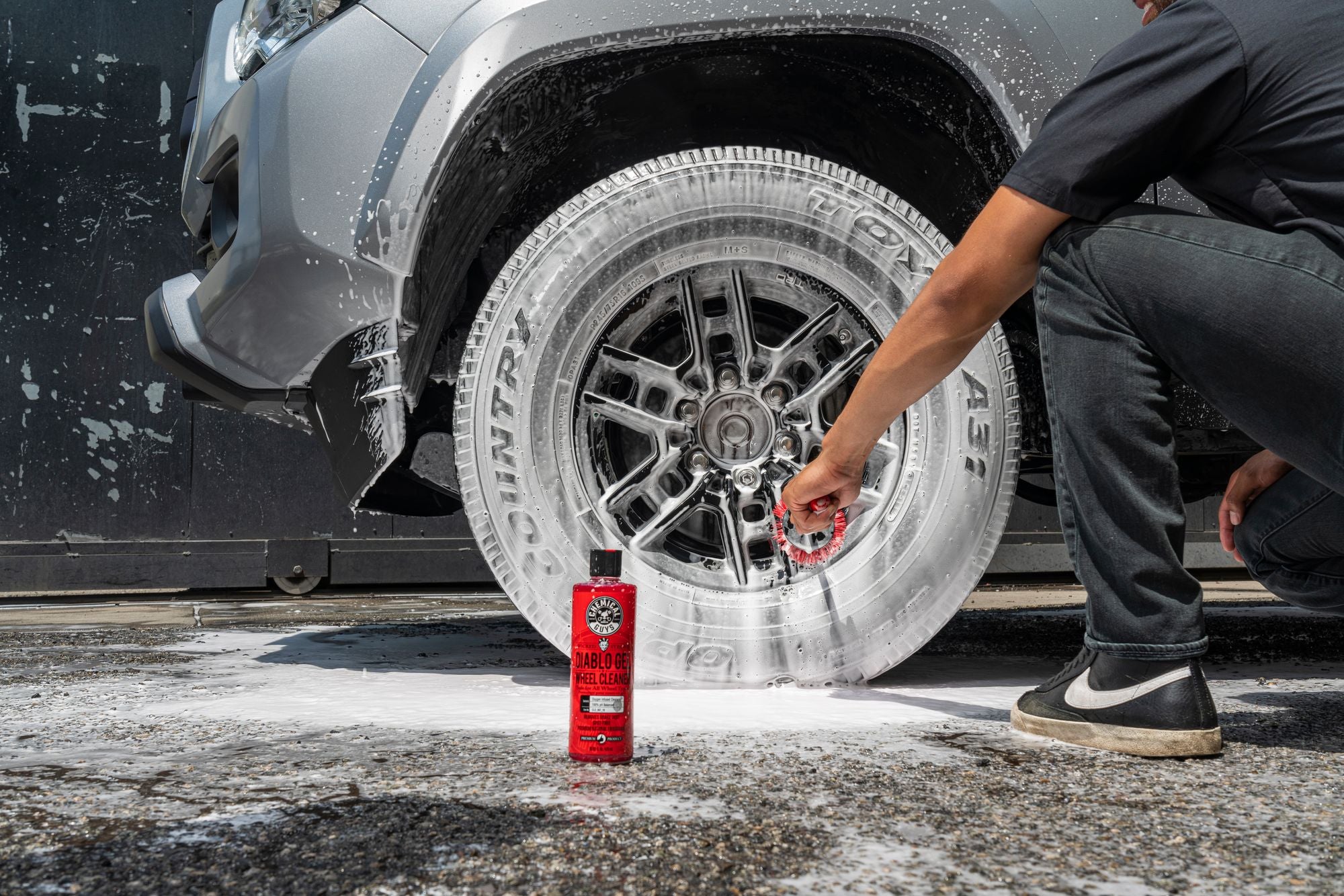 Cleaning a wheel with Diablo Wheel Cleaner and a Red Rocket Brush