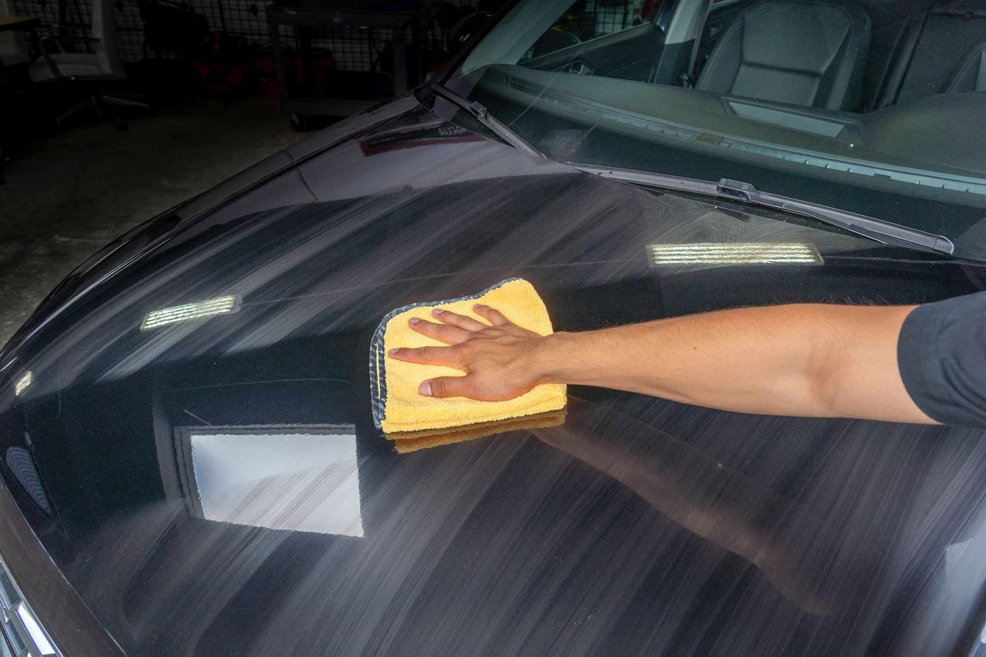 Professional Grade Microfiber Towel leaving a streak-free finish when wiping down paintwork.